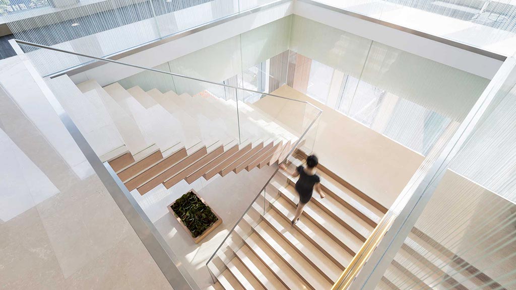 A person walking up a staircase.