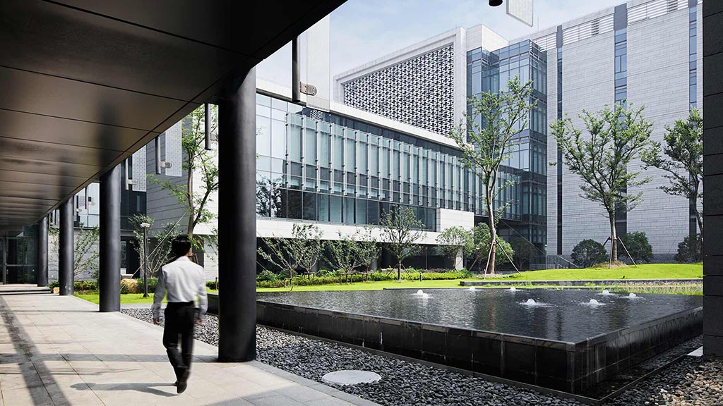 A person walking outside of a building.