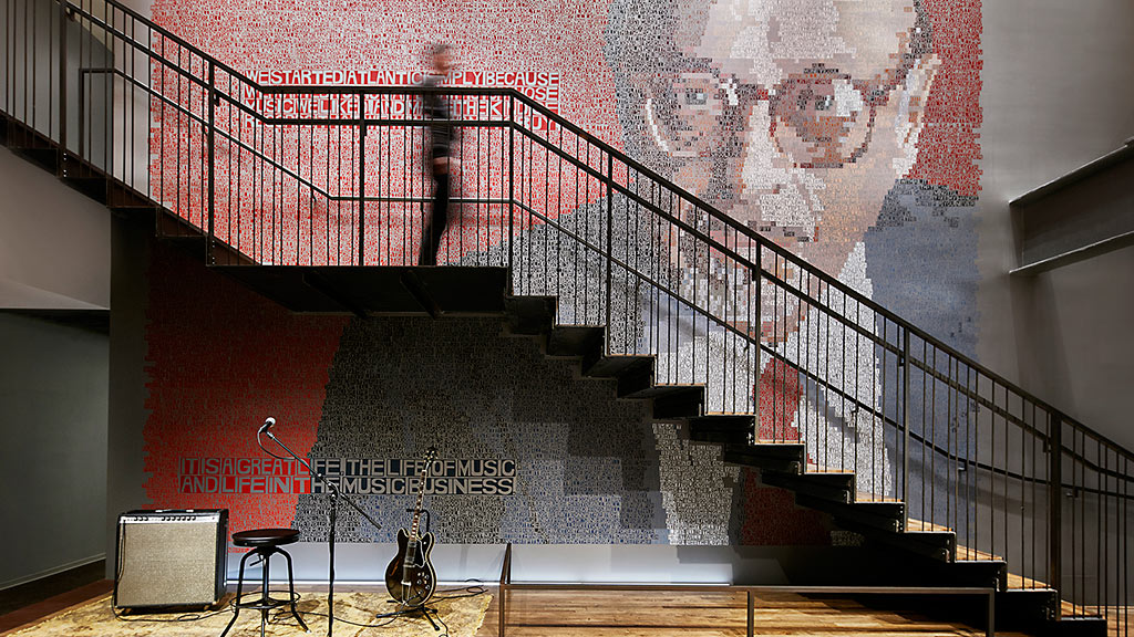 A staircase with a light on the side.