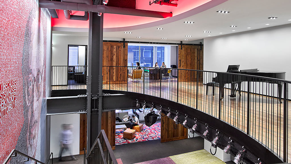 A room with a balcony and a railing.