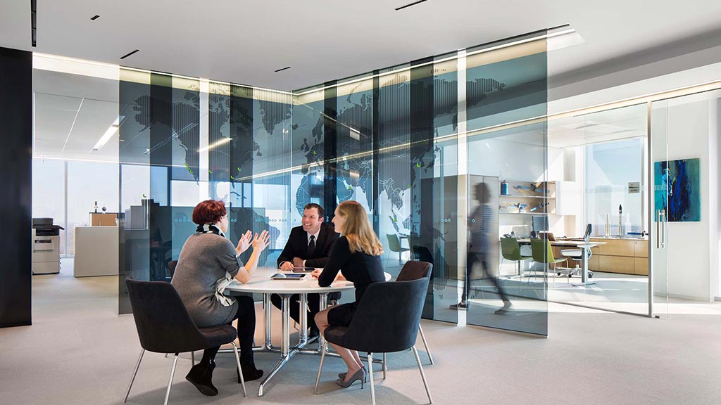 A group of people sitting around a table.