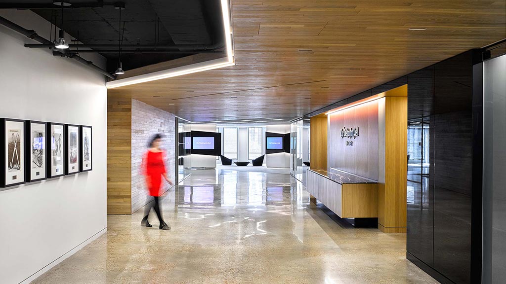 A person walking in a hallway.