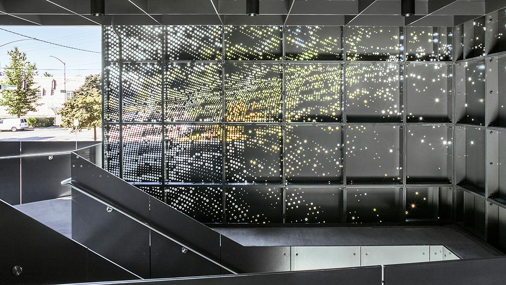 A large glass wall with a large window.