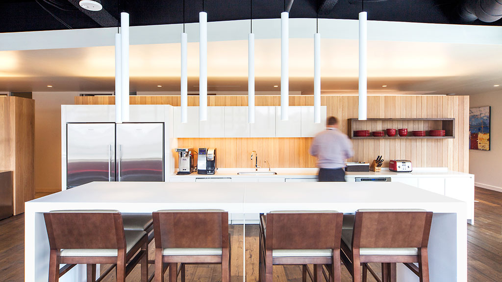 A person standing in a kitchen.