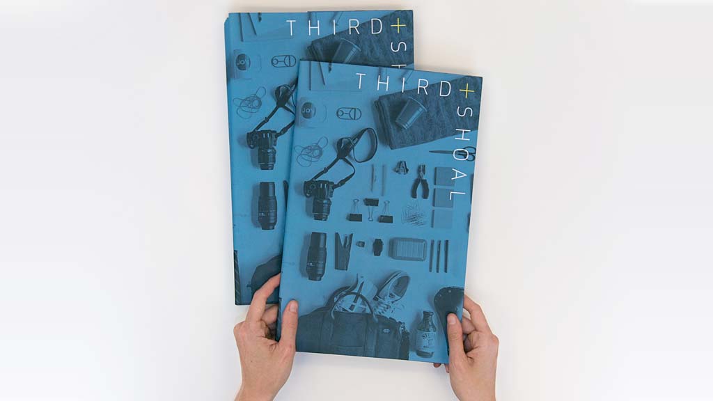 A person drawing on a piece of paper.