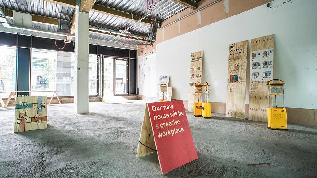 A large room with a few signs.