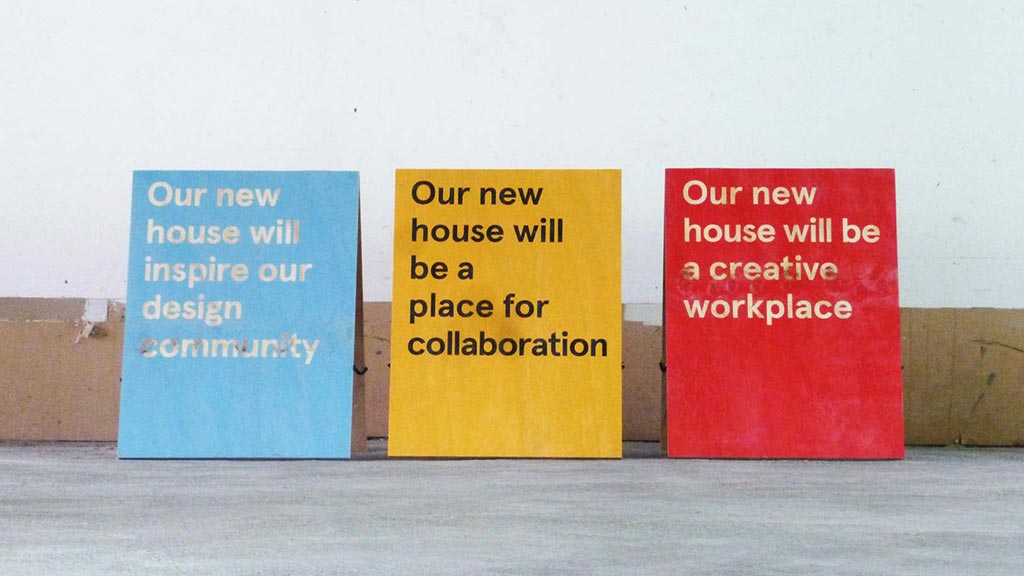 A few signs on a wall.