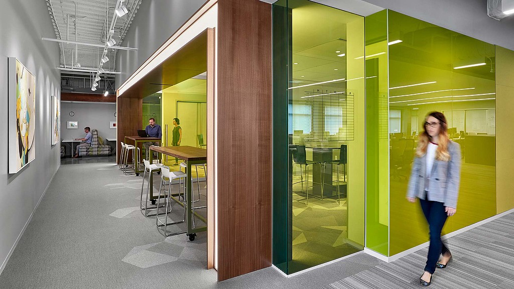 A woman walking through a building.