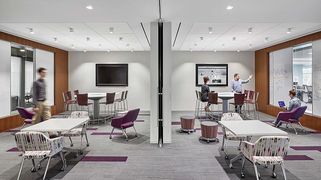 A room with tables and chairs.
