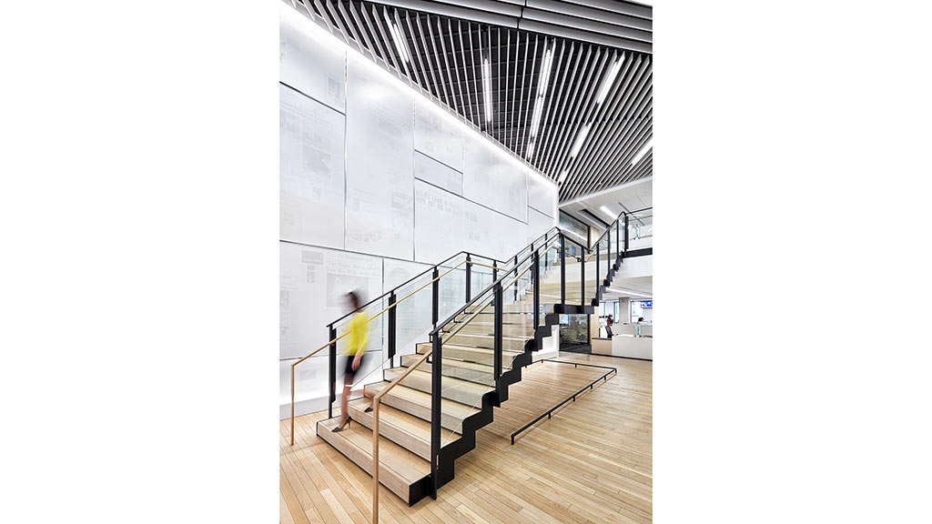 A person walking up a staircase.