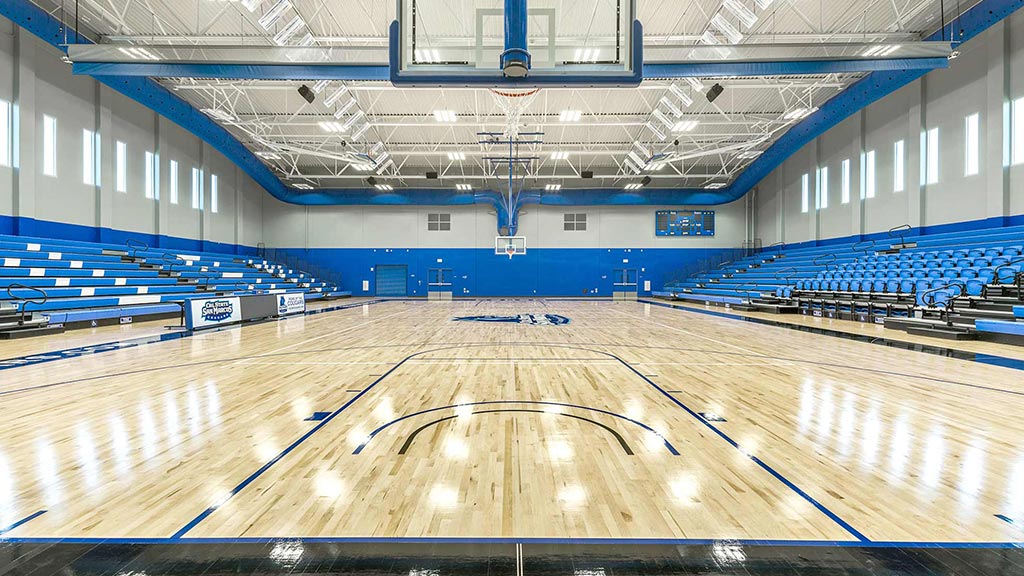 A basketball court with a basketball hoop.