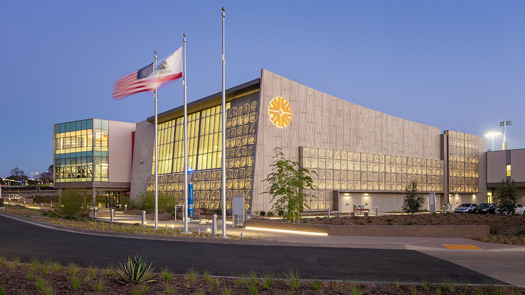 A building with flags in front of it.
