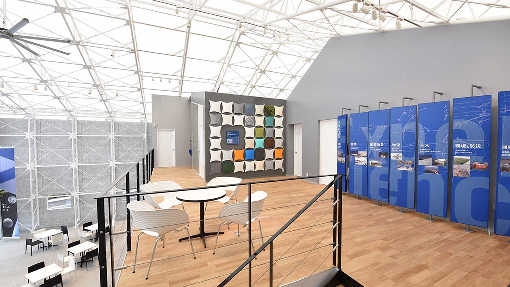 A room with tables and chairs.