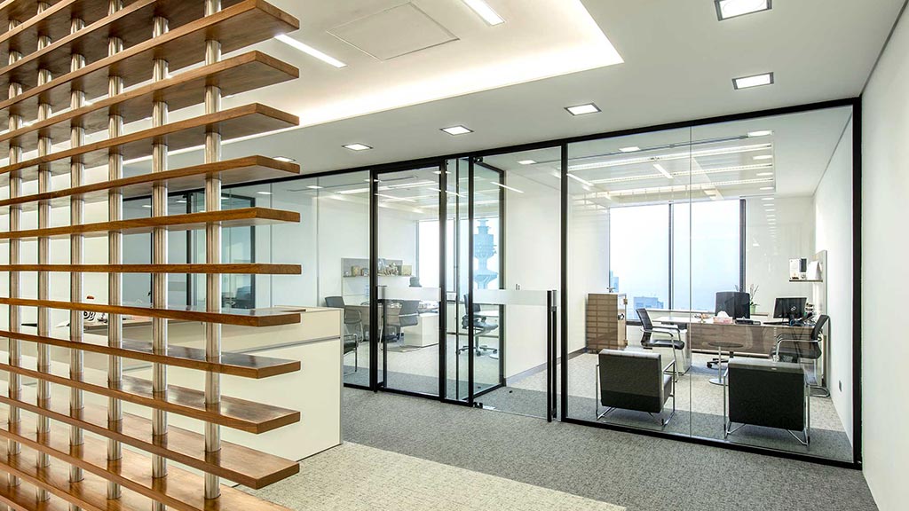 A room with glass walls and a staircase.