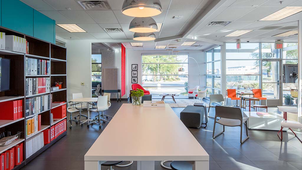 A room with tables and chairs.