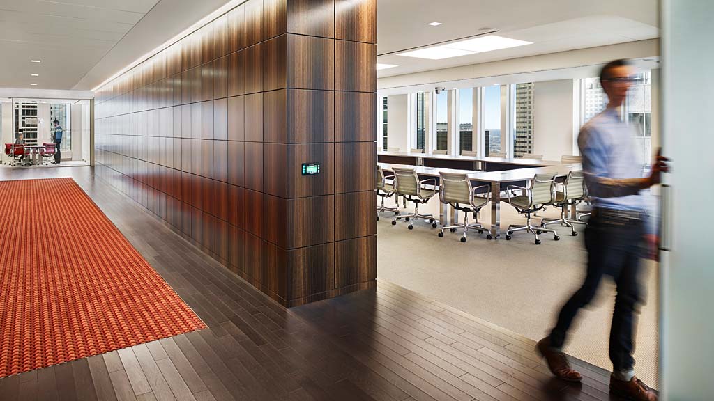 A person walking in a hallway.