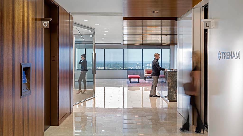 A few people in a hallway.