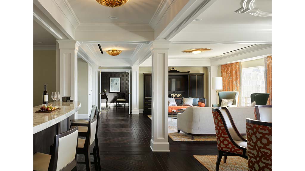 A large room with a wood floor and a wood floor.