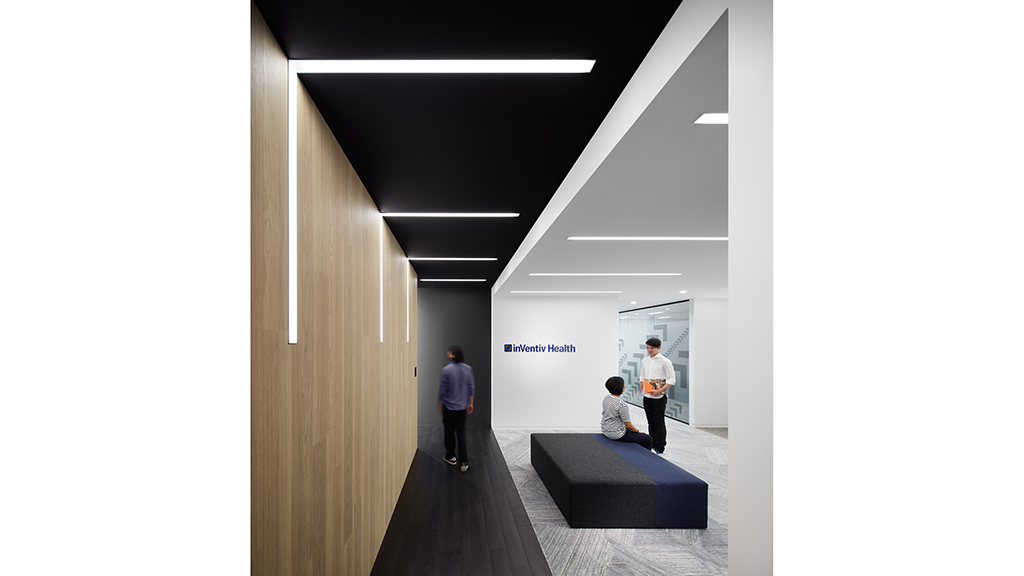 A few men in a hallway.