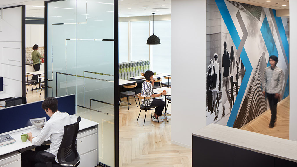 A man and a woman in an office.