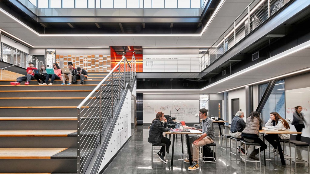 People sitting at tables in a building.