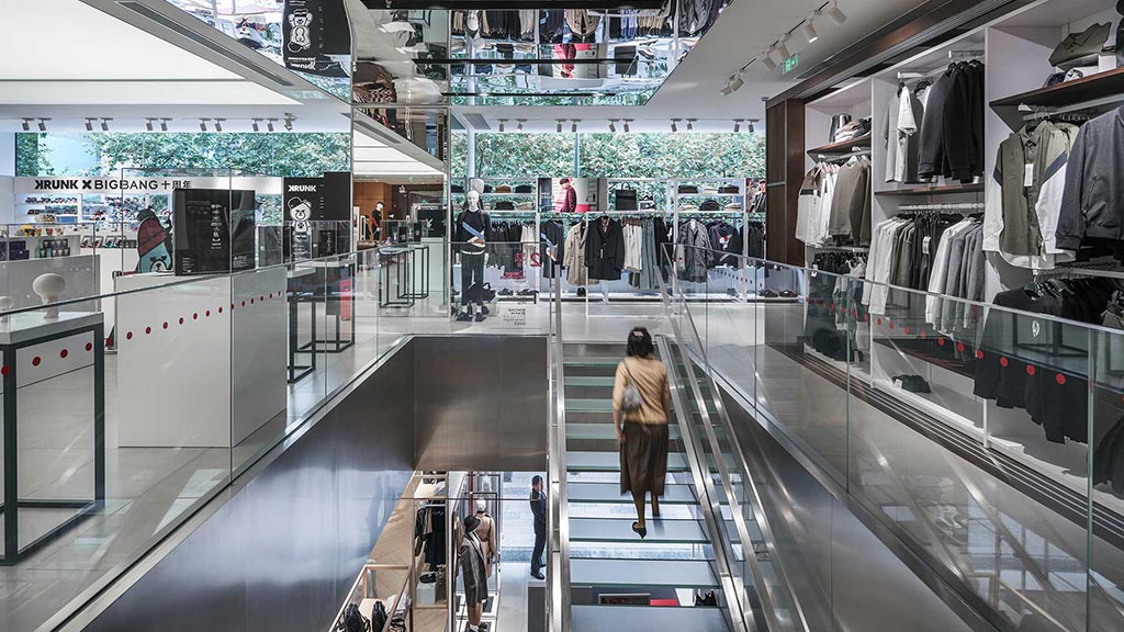 A person walking through a shopping mall.