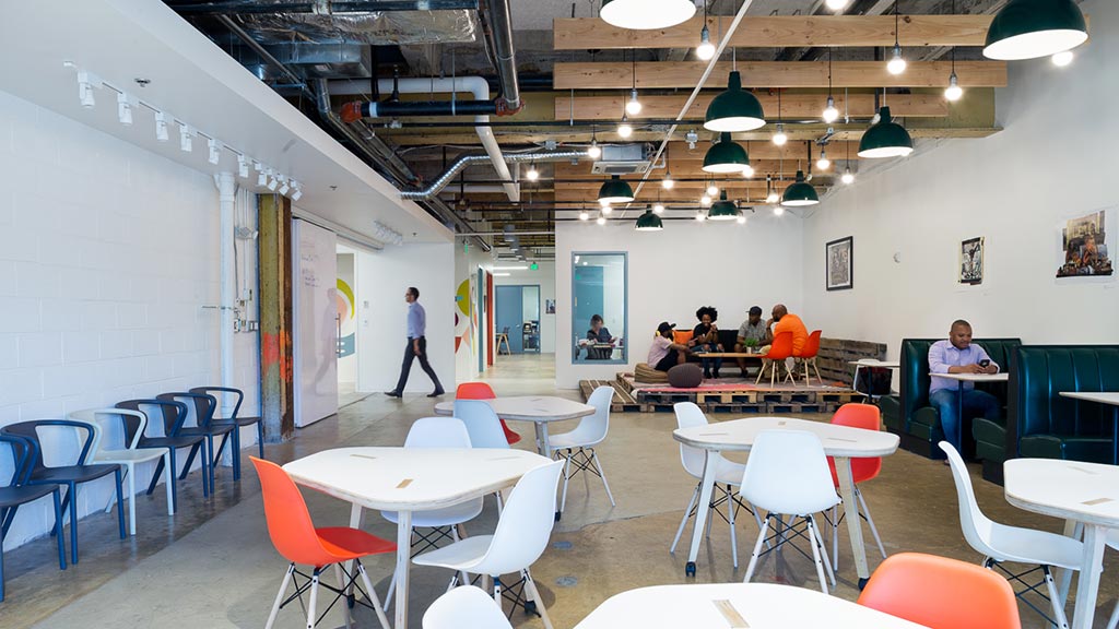 A room with tables and chairs.