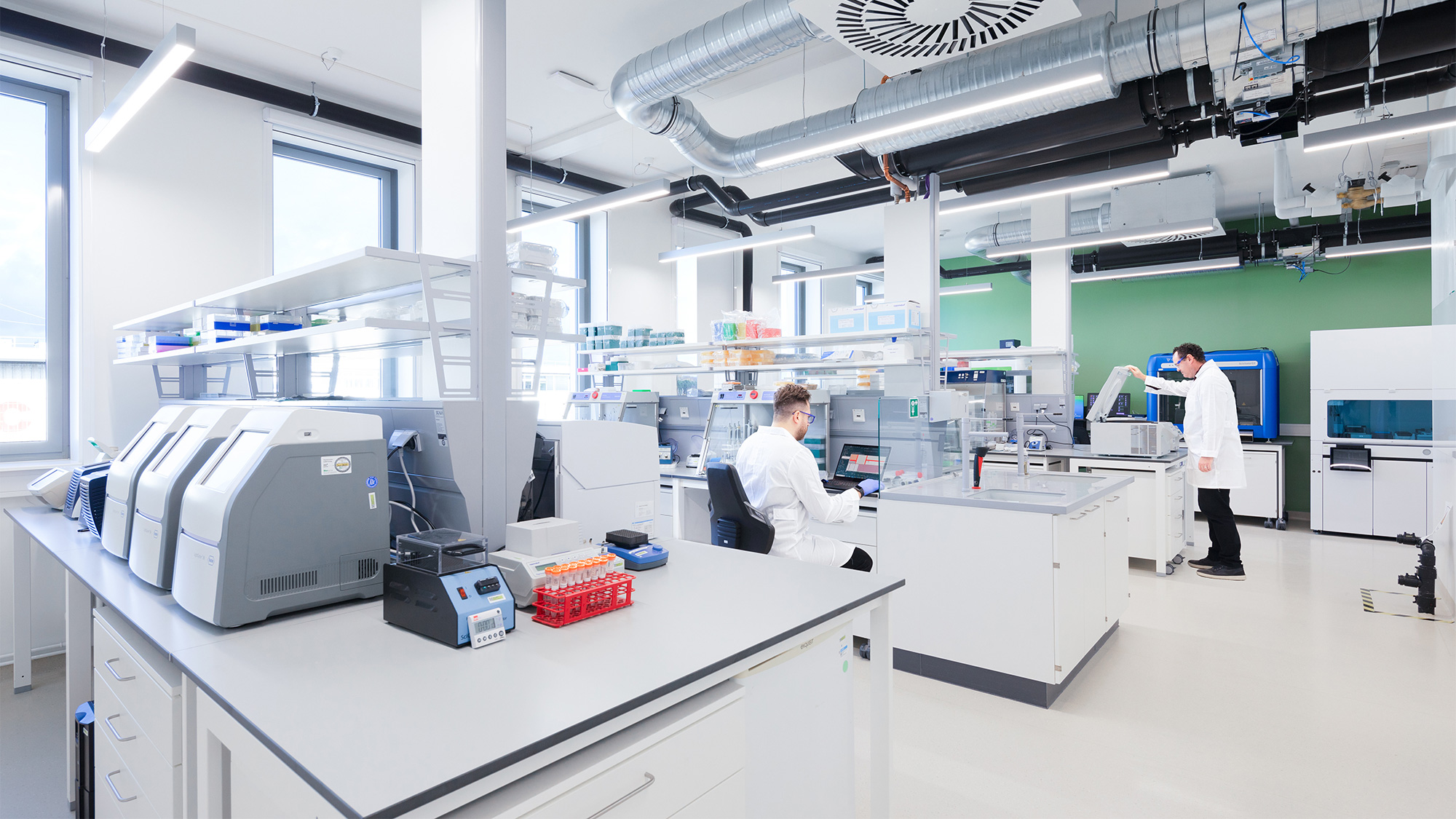 A couple of men in a laboratory.
