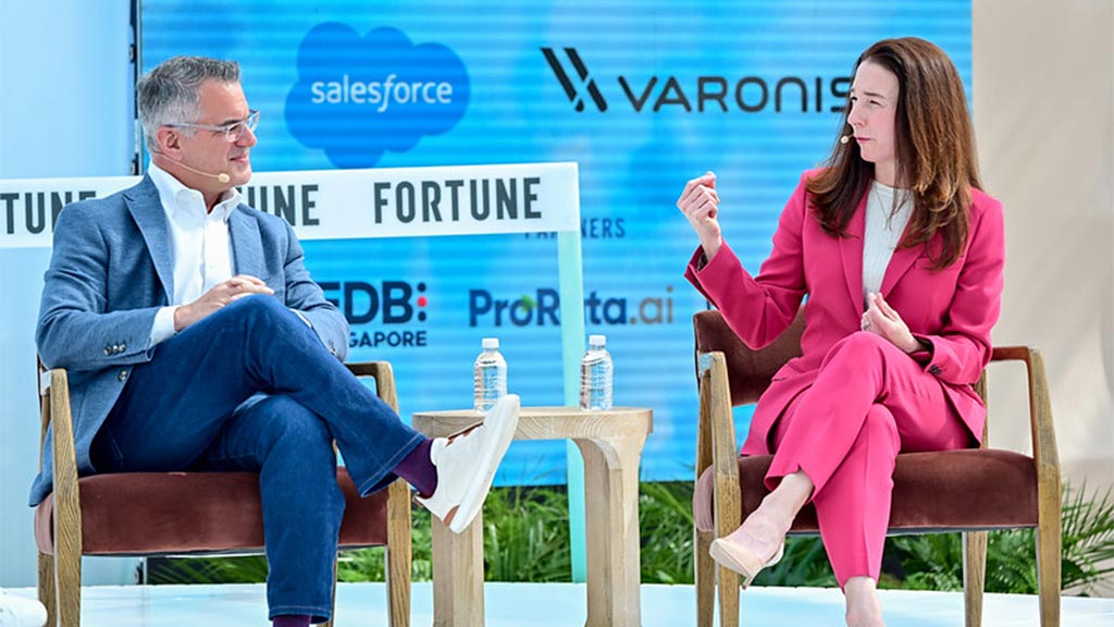 A man and a woman sitting in chairs.