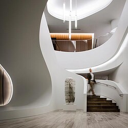 A person standing on a staircase.