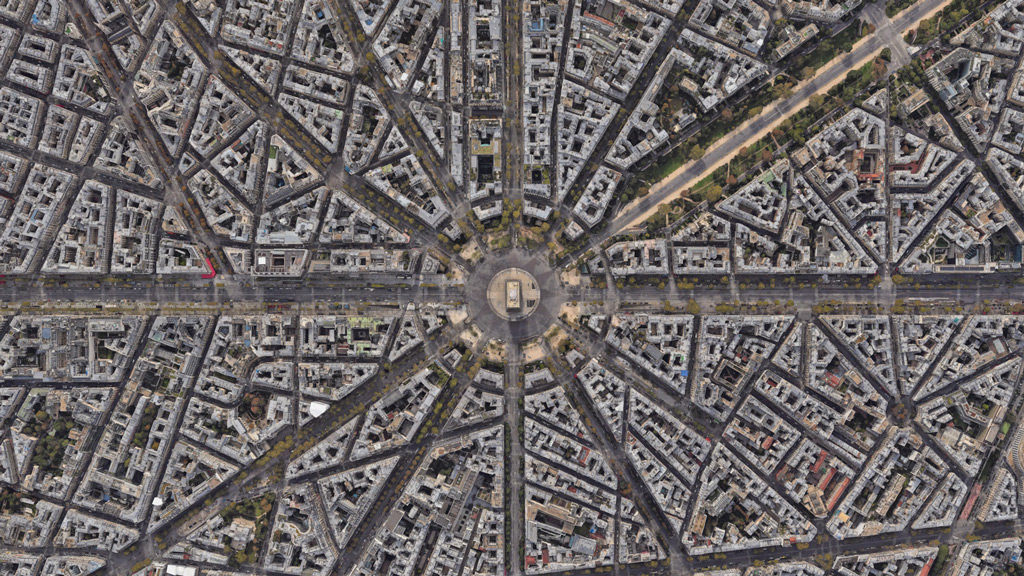 A satellite view of Paris city blocks with the Arc de Triomphe in the center.
