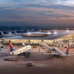 A group of airplanes at an airport.