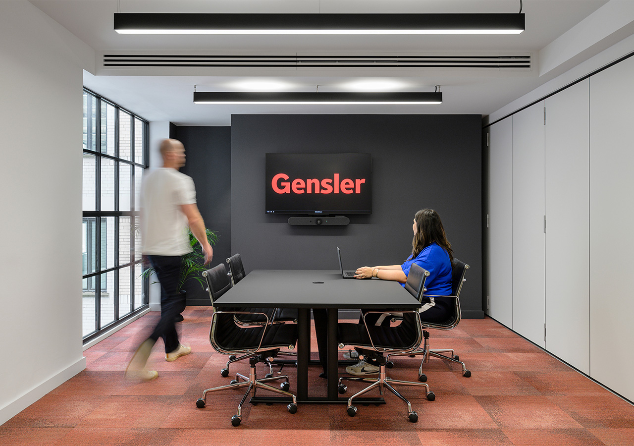 A man and a woman in an office.