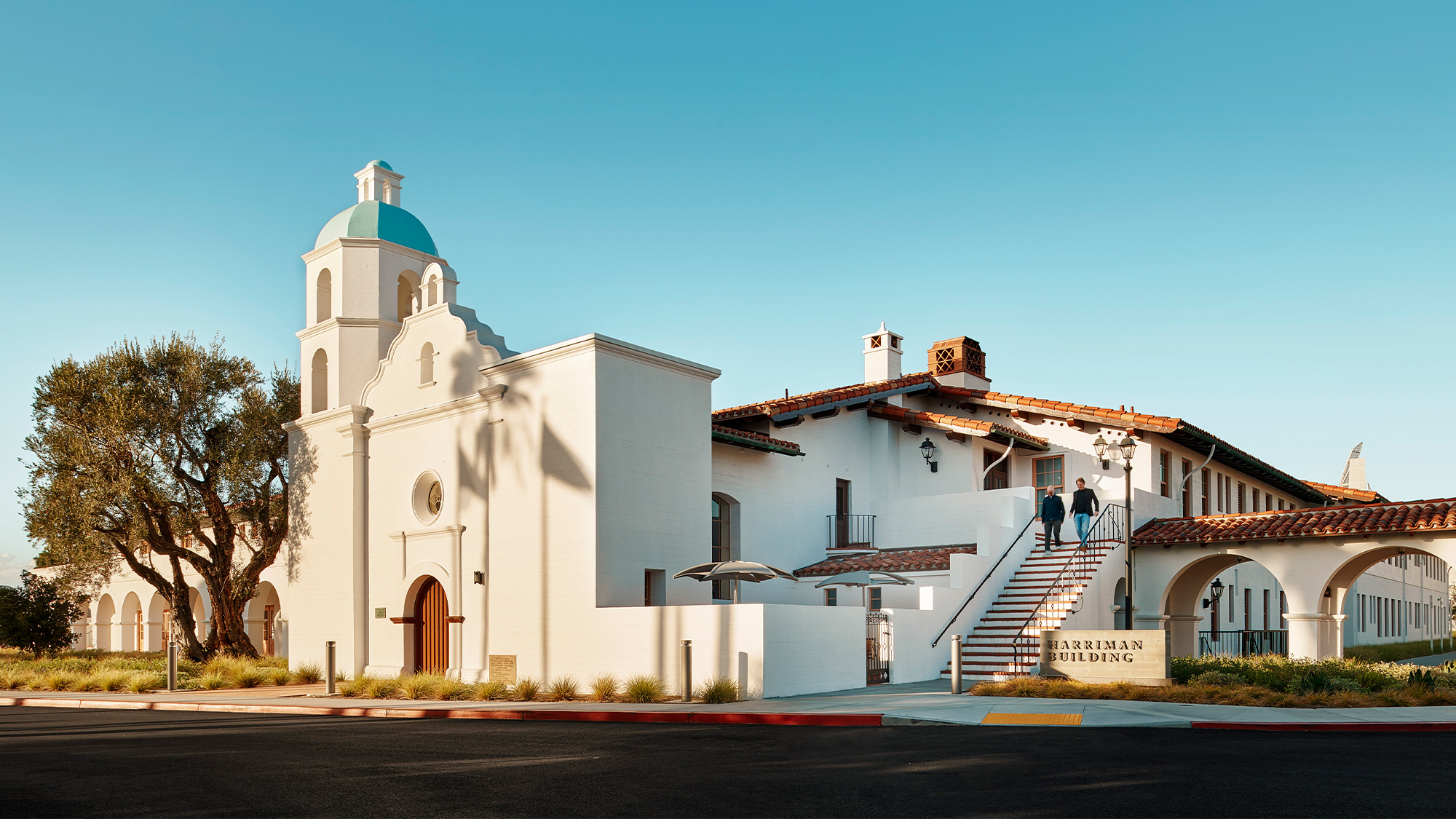 A white building with a blue sky.