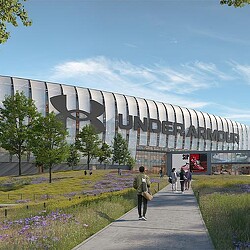 A building with a walkway and people walking around.