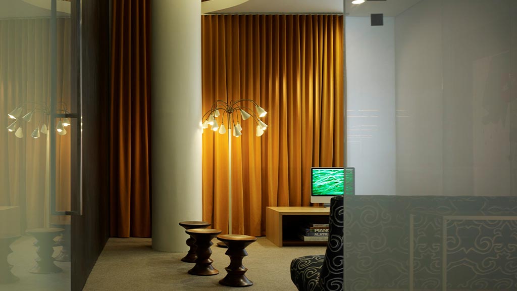 A room with a tv and a table.