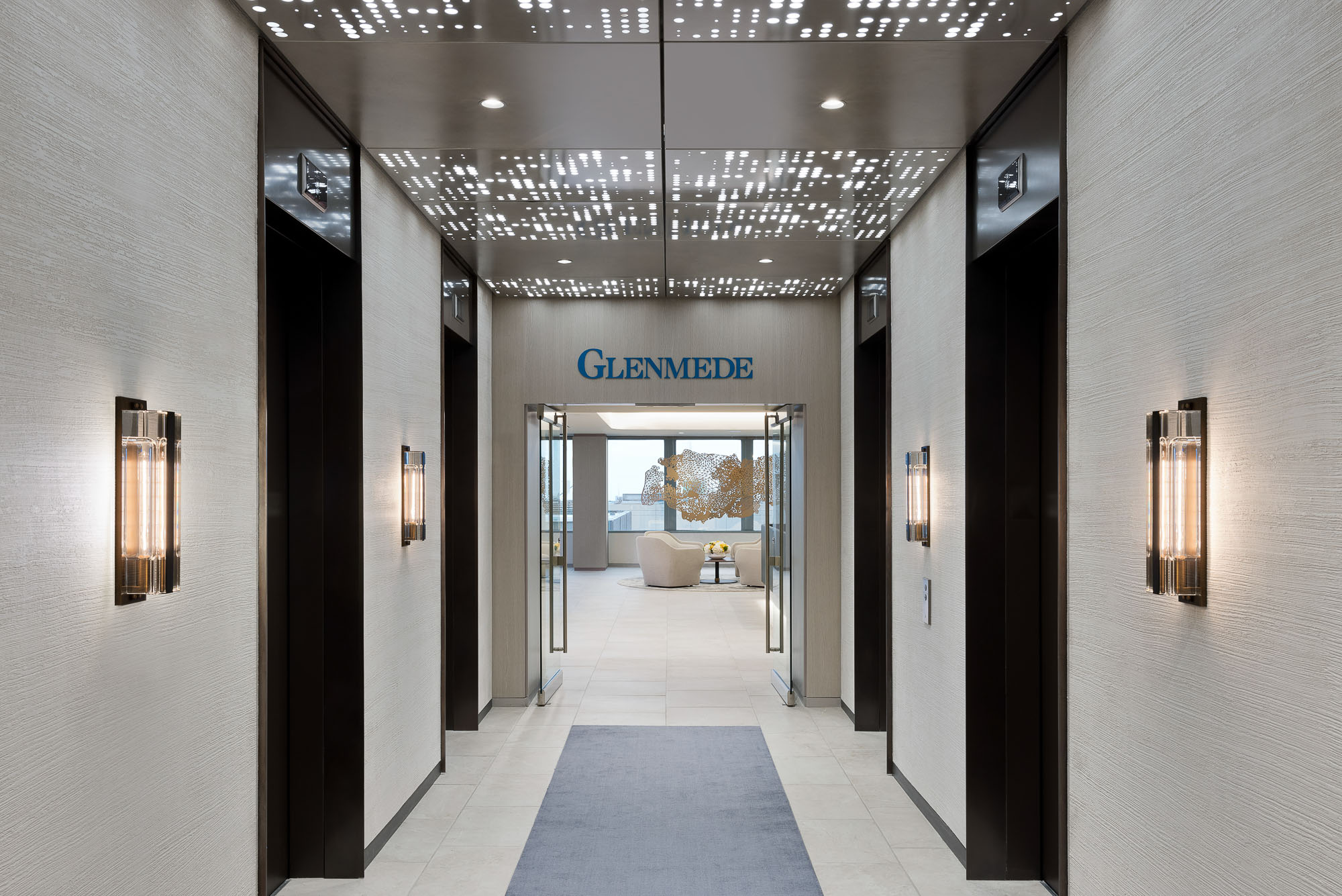 A long hallway with glass doors.