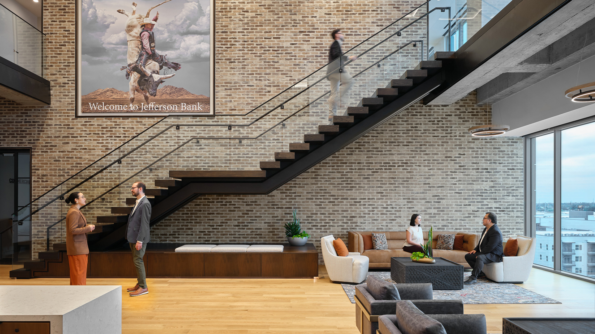 People in a room with stairs.