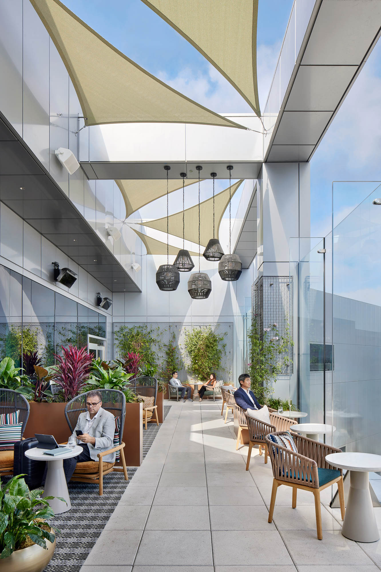 People sitting at tables in a building.