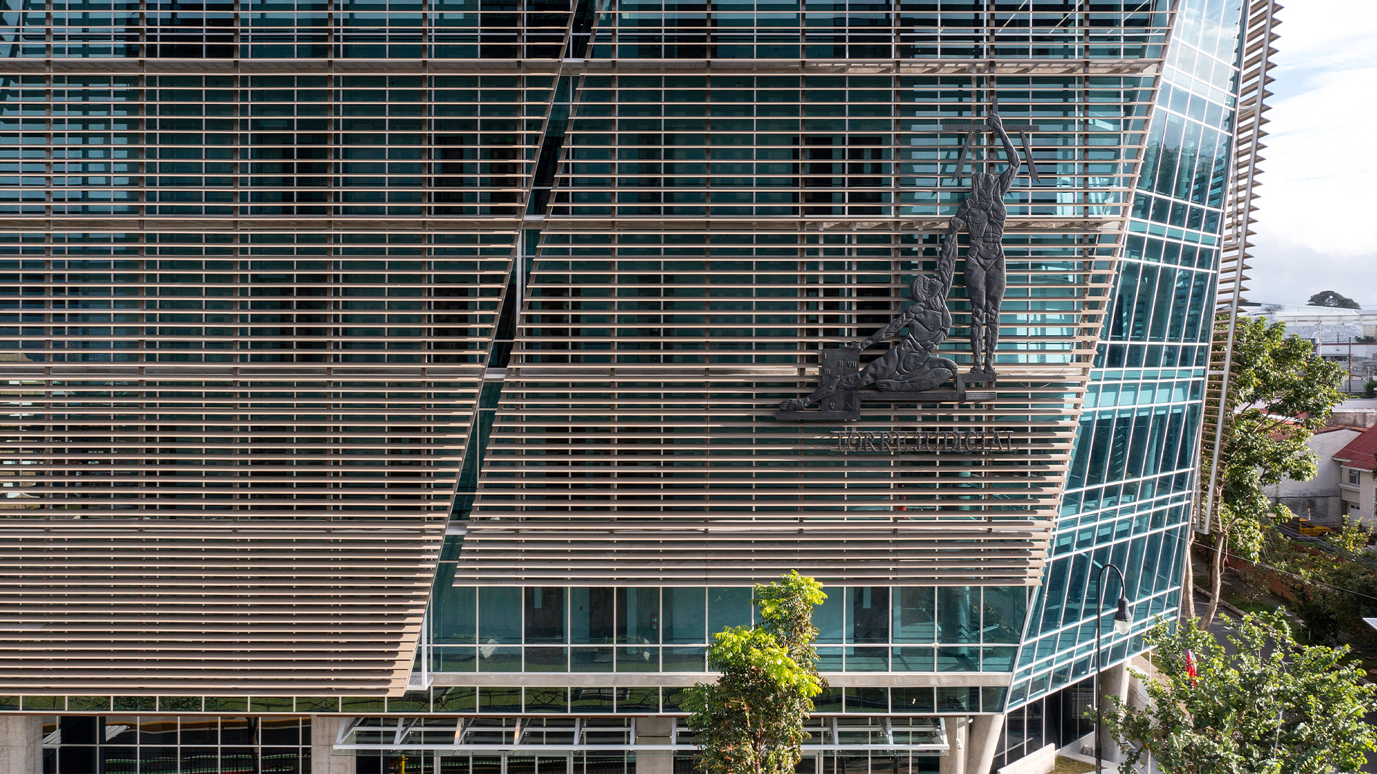 A building with a statue on the side.
