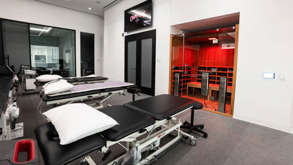 A room with a few beds.