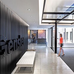 A person walking in a hallway.