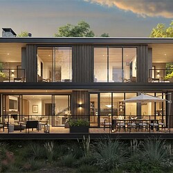 A building with windows and tables outside.