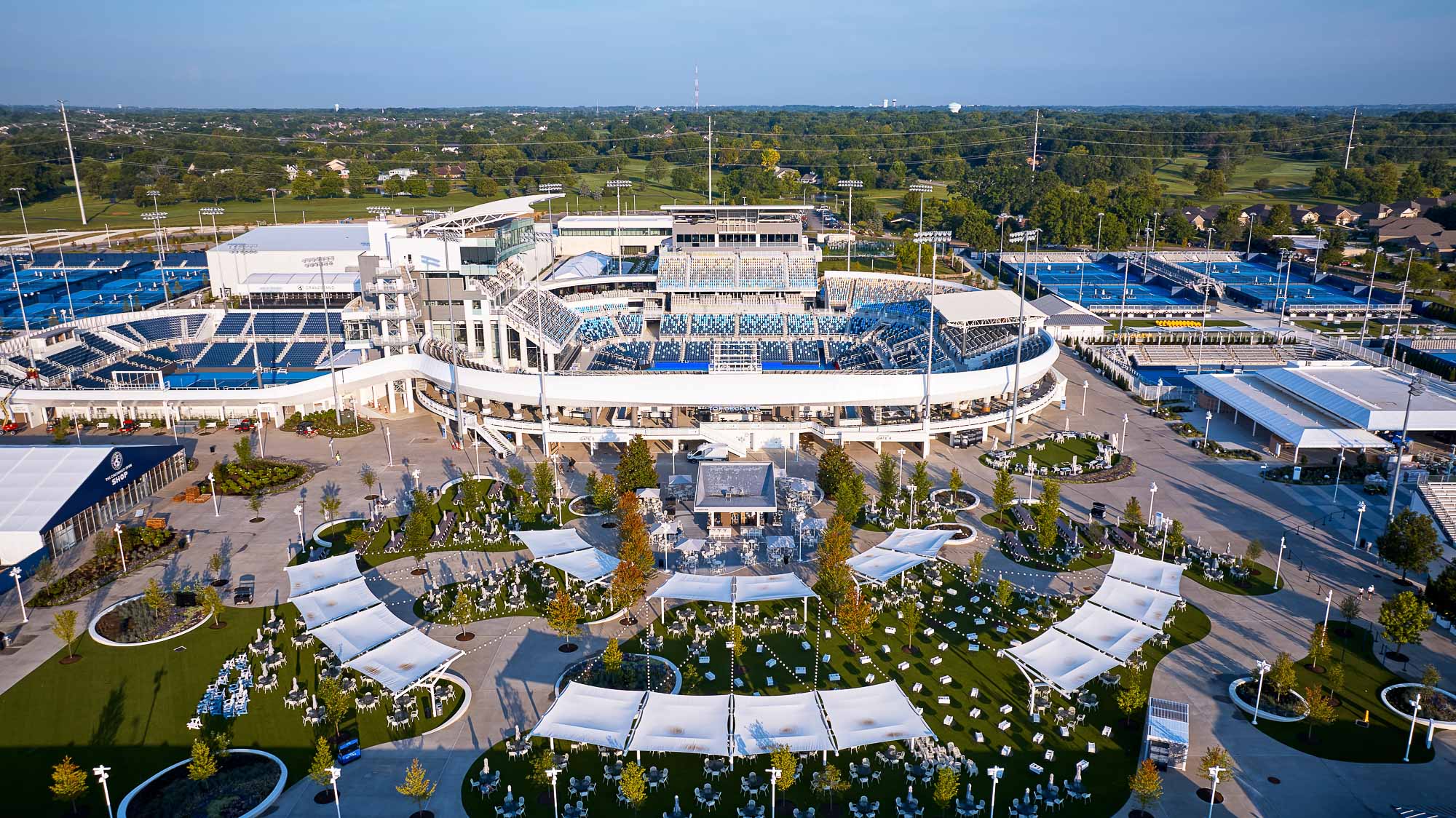 A large building with a pool in front of it.