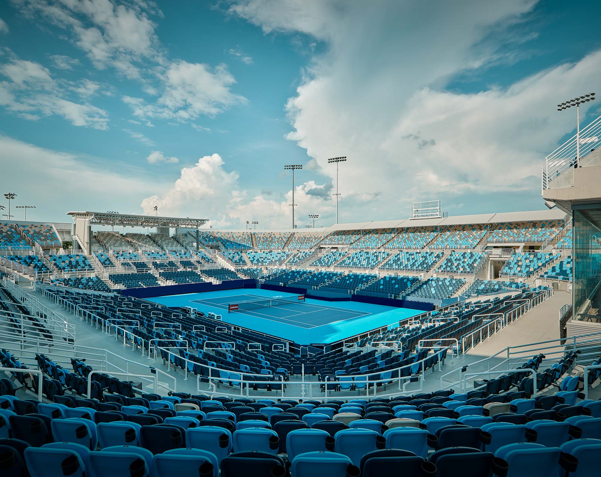 A swimming pool with chairs around it.