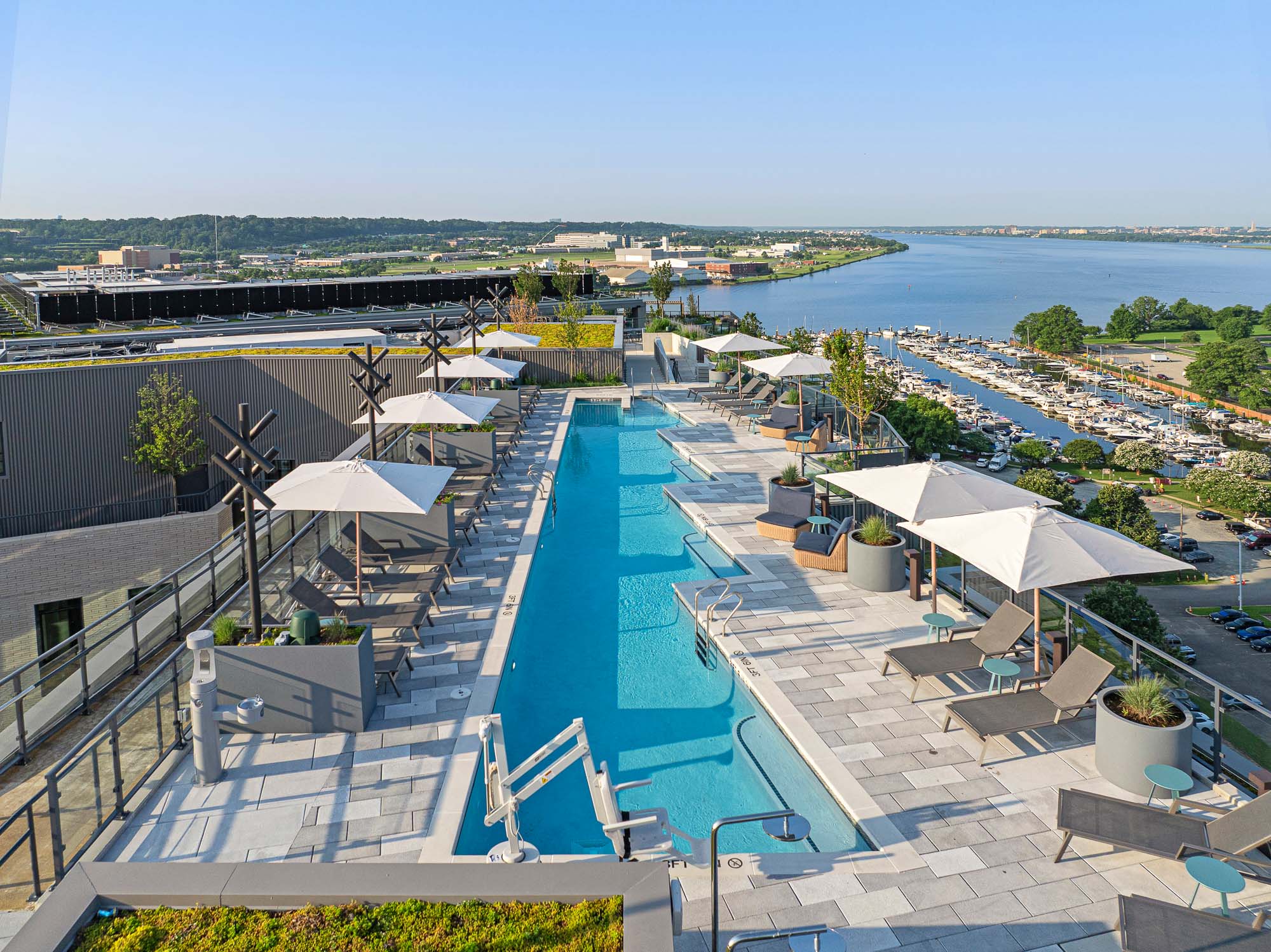 A swimming pool with umbrellas.