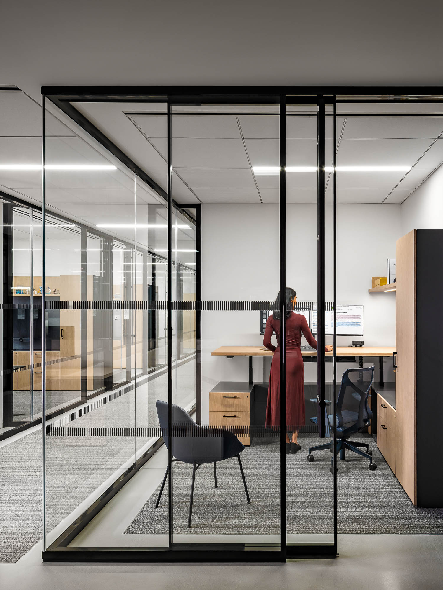A person standing in an office.