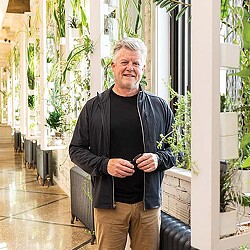 A man standing in a hallway.