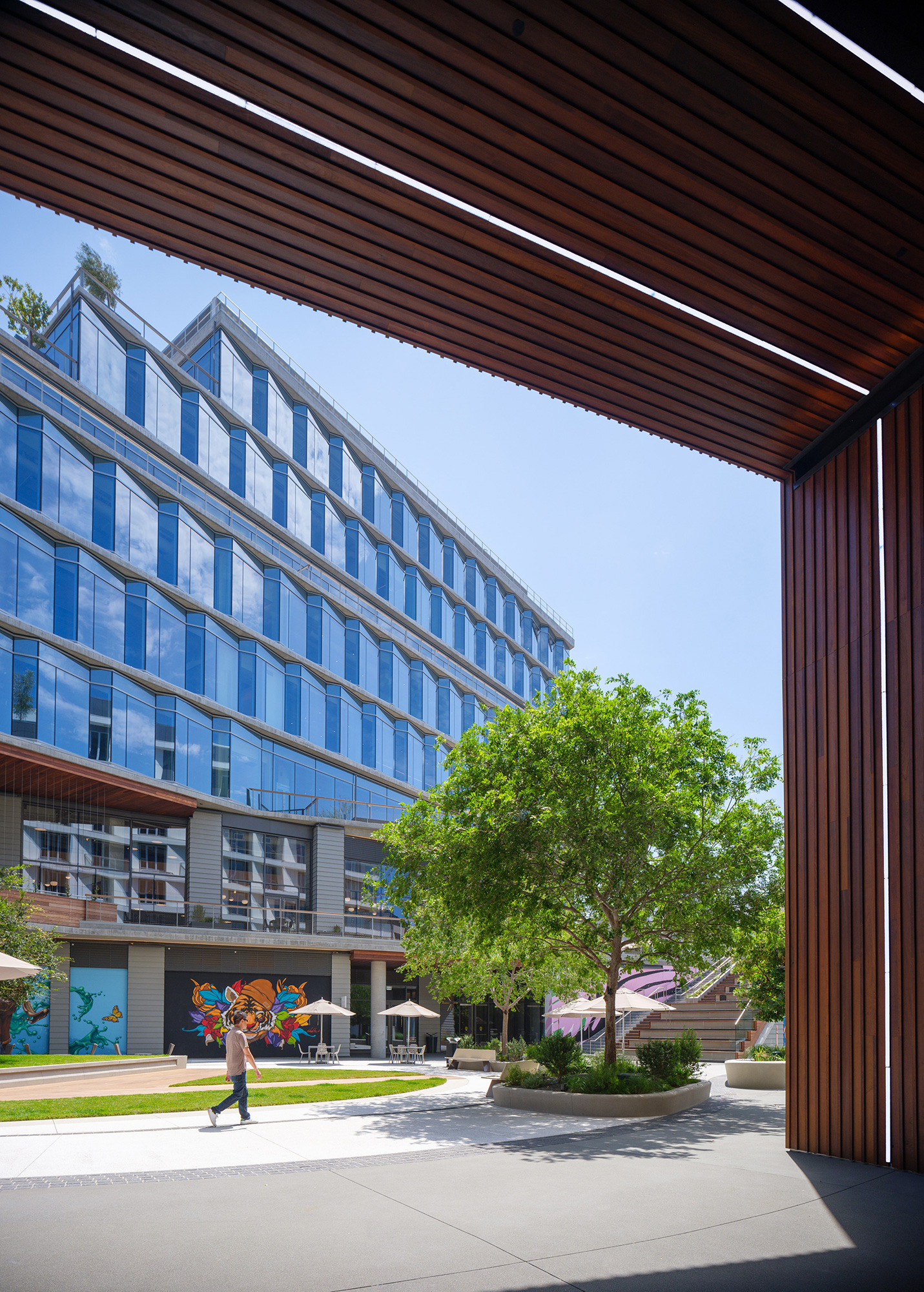 A person walking outside of a building.