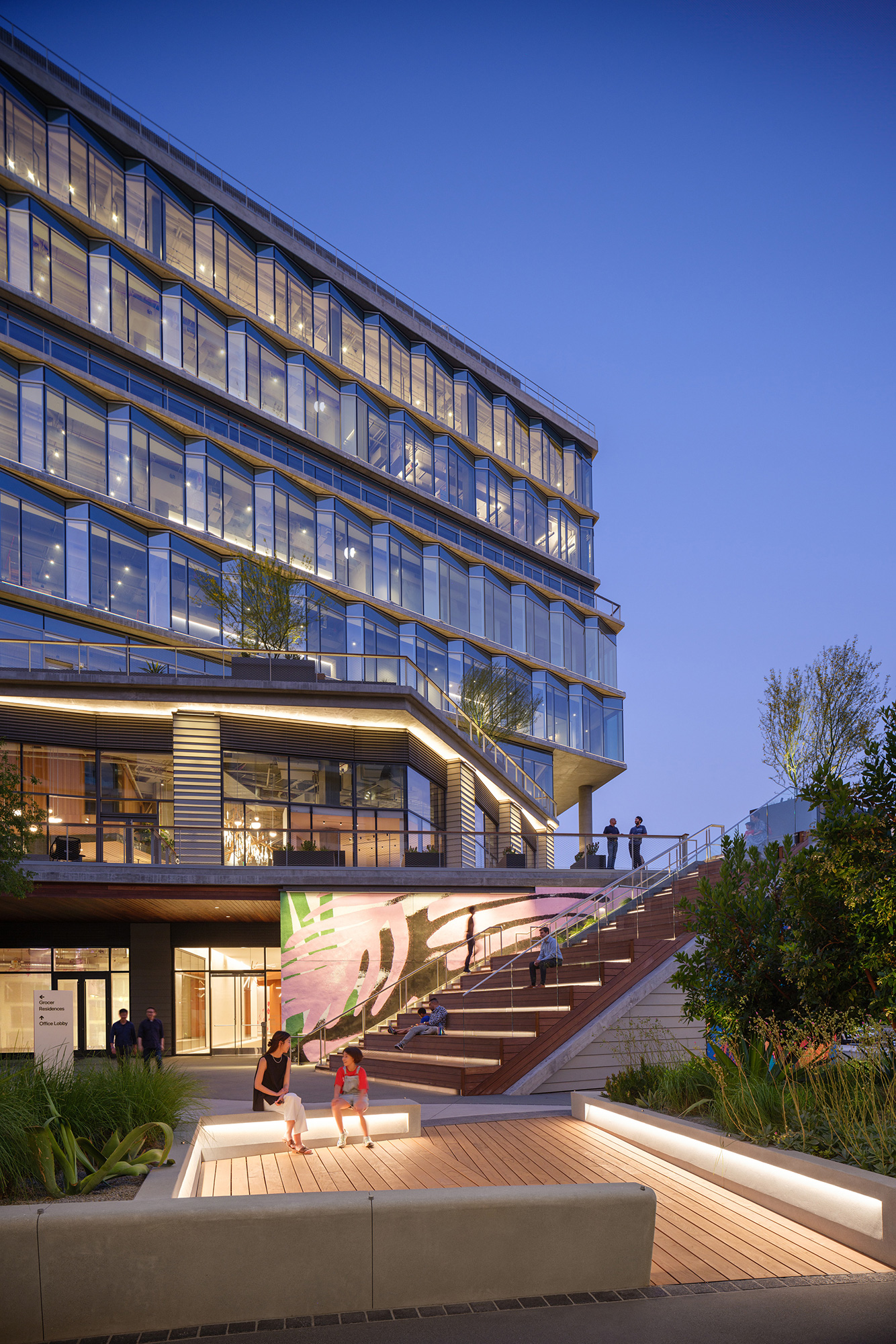 A building with stairs and people outside.